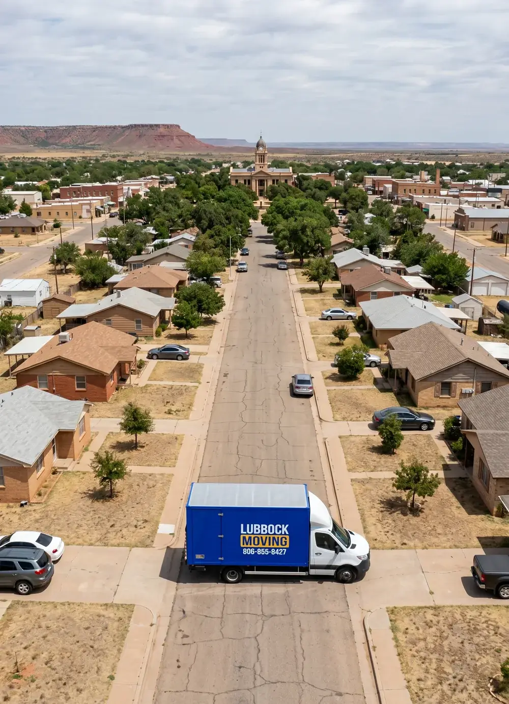 Lubbock Moving Company blue moving truck on a residential street in Post, Texas