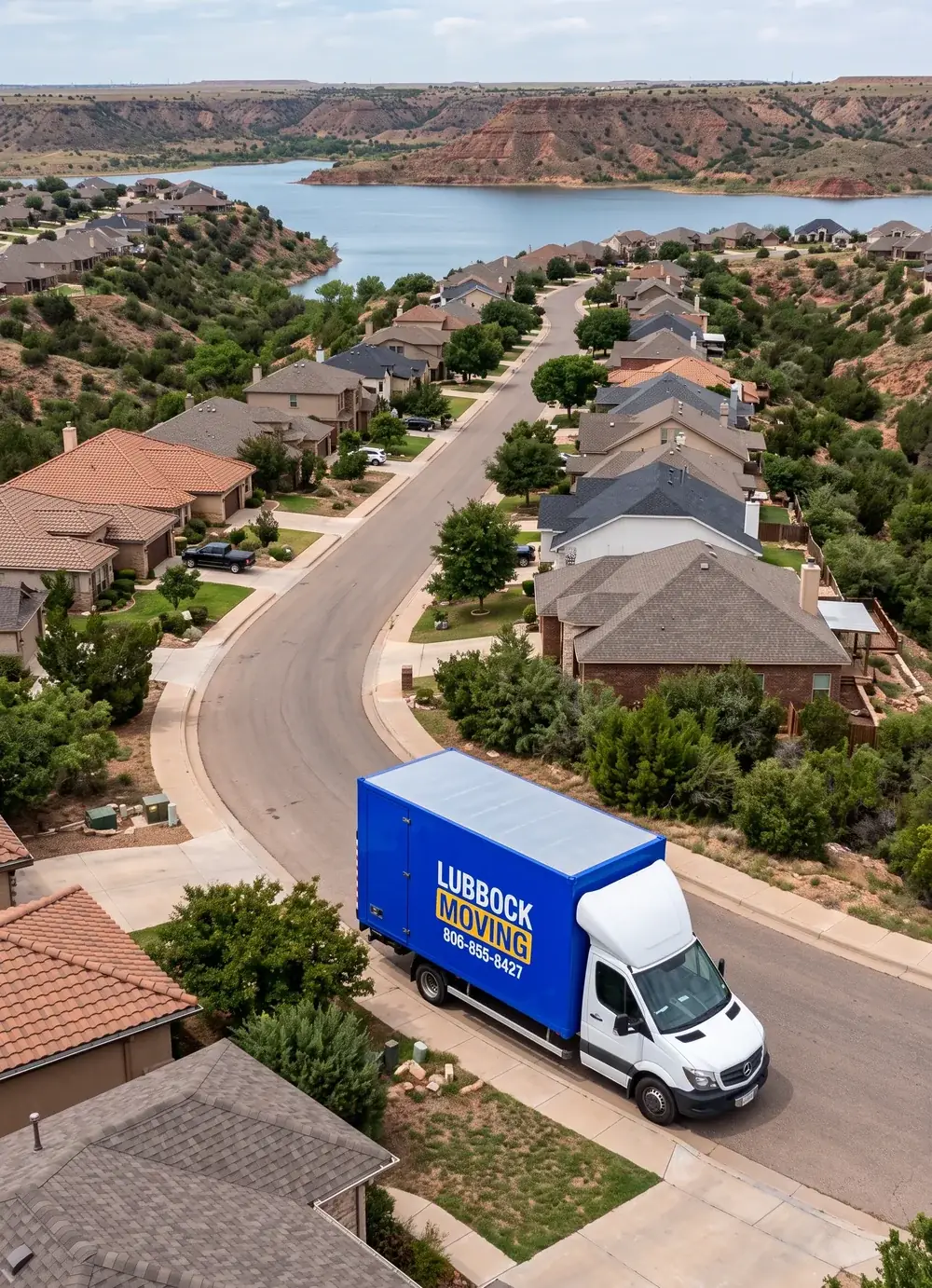 Lubbock Moving Company blue moving truck on a residential street in Ransom Canyon, Texas