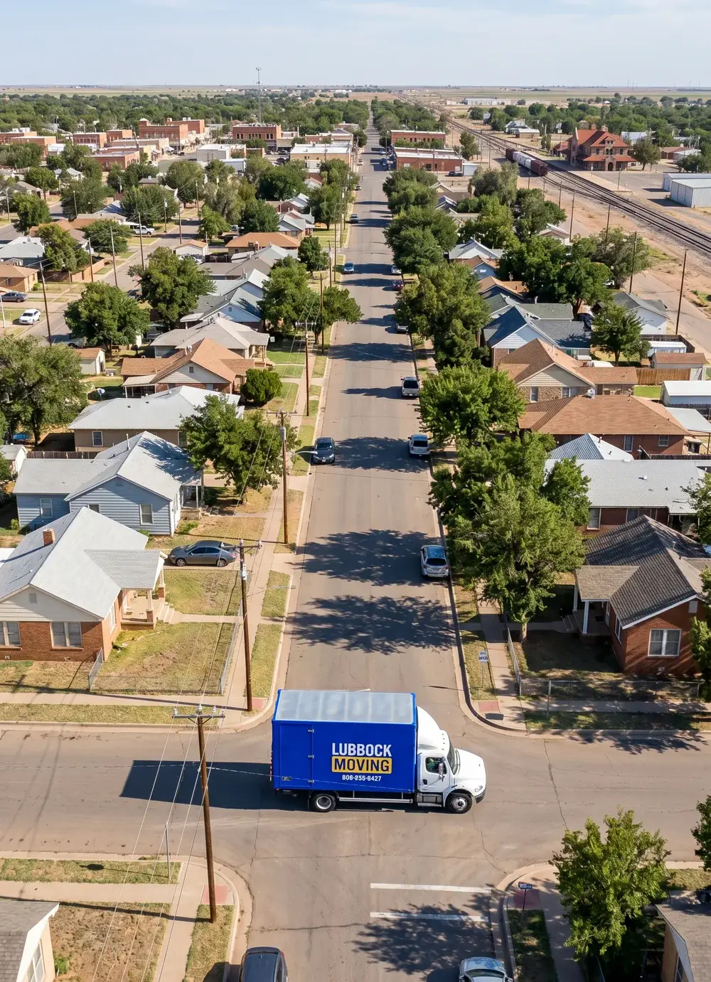 Lubbock Moving Company blue moving truck on a residential street in Slaton, Texas